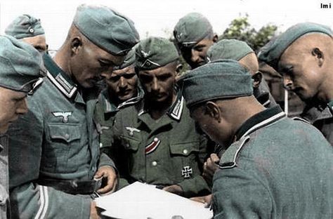 Wehrmacht soldiers reading a map.jpg